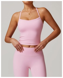 Detail of pink brushed athletic yoga tank top with thin straps and matching high waist leggings