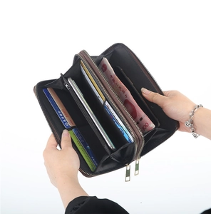Detailed interior of double zipper faux leather wallet with card slots and phone pocket