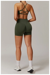 Close-up of seamless high-waist yoga shorts with scrunch butt detail and cross-back sports bra