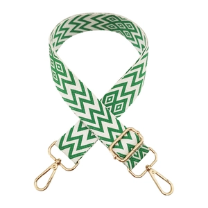 Adjustable green and white geometric woven shoulder strap with gold lobster clasps