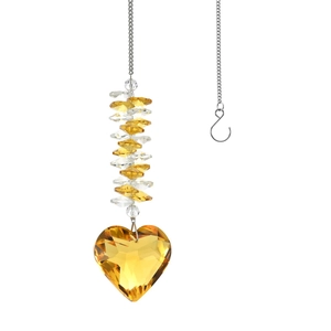 Detailed view of heart-shaped yellow crystal suncatcher with clear faceted beads
