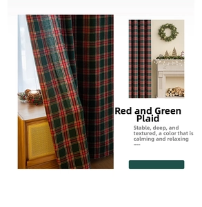 Detail of red and green plaid Christmas curtain fabric with a festive fireplace scene