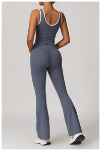 Rear view of sleek blue yoga tank top and matching flared pants for women