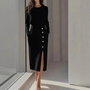 Elegant black long sleeve midi dress with side slit and decorative gold buttons