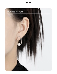 Wearing display of modern hollow oval S925 silver stud earrings with elegant white pearl