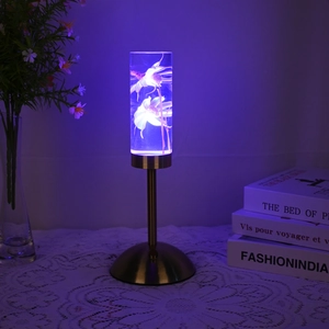 Detail view of acrylic night light with white flowers and purple LED ambient glow