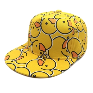 Yellow snapback baseball cap featuring all-over cartoon duck print in a 45-degree view