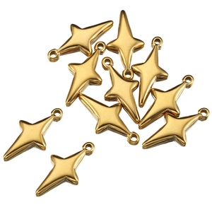 Close-up of ten gold stainless steel four-pointed star charms with top loops for DIY jewelry