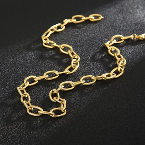 Detailed close-up of a 9mm gold-toned stainless steel twisted oval link chain necklace