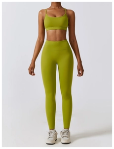 Detail of high-waisted olive green yoga leggings with supportive compression waistband