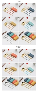 Flat lay macro of multi-colored portable stainless steel cutlery sets with storage cases