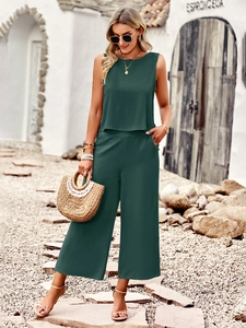 Women's dark green sleeveless top and cropped wide-leg pants set in Mediterranean style