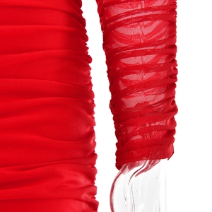 Detailed close-up of red mesh dress showing ruched long sleeves and fabric texture