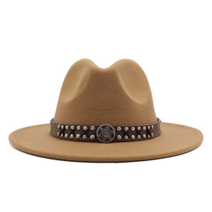 Close-up of deep camel fedora hat with studded leather band and metal buckle detail