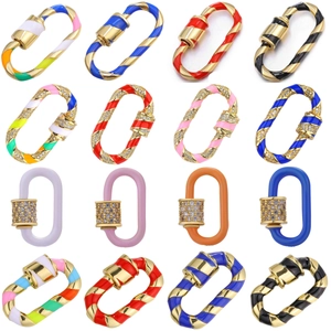 Assorted oval screw clasps in gold metal with enamel and rhinestones on white base