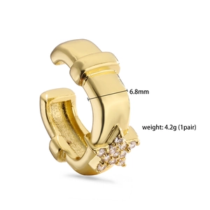 Close-up of golden wide ear cuff with star pattern cubic zirconia and 6.8mm width