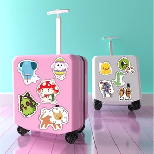 Close-up of cute cartoon waterproof stickers on pink and grey children's luggage cases