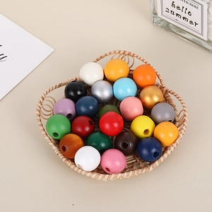 Colorful 16mm polished wooden beads in a woven basket for DIY jewelry making