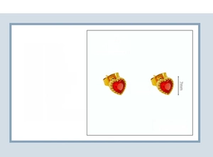 Macro detail of heart-shaped red zircon stud earring in 18K gold-plated stainless steel