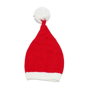 Close-up of red and white knitted Christmas hat with pompom and woven texture detail