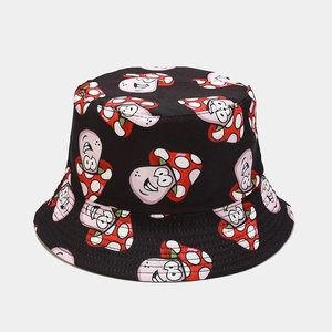 Detail of black reversible bucket hat featuring cartoon mushroom prints and fine stitching