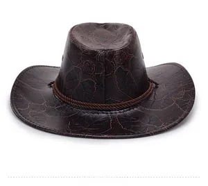 Detail of dark brown western cowboy hat with embossed leaf texture and braided rope band