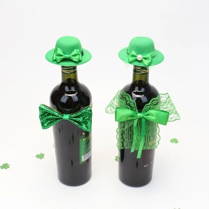 St. Patrick's Day green wine bottle decor with mini top hats and bow ties detail