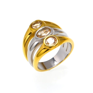 Detail of three-layer stacked titanium rings with oval champagne zircon in bezel setting