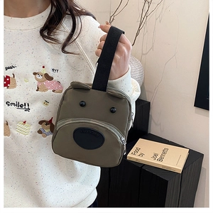 Army green nylon tote bag featuring a cute 3D cartoon bear design and front zipper pocket