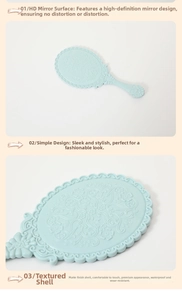 Detail of light blue handheld mirror with vintage floral carving and matte finish texture