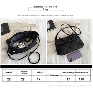 Size guide for black quilted nylon crossbody bag showing measurements and capacity info
