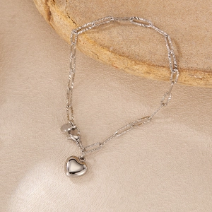 Polished silver heart pendant bracelet with unique elongated oval chain links and clasp