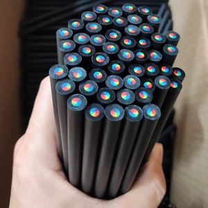 Close-up of 7-color rainbow core inside black wooden pencils for creative drawing