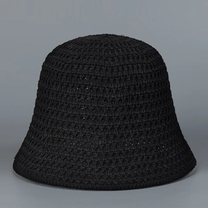 Close-up of black hollow crochet knit bucket hat showing breathable woven texture