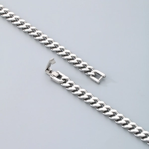 Polished silver Cuban link chain necklace for men and women featuring a minimalist metal clasp
