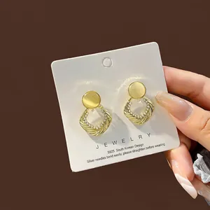 Elegant gold S925 silver needle stud earrings with yellow cat eye stone and diamonds