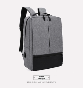 Detail view of Oxford cloth business backpack showing USB charging port and wide straps