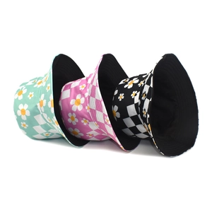Checkboard and sunflower reversible bucket hats in mint green, rose pink, and black colors