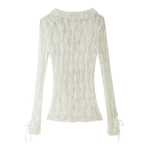 Detail view of white lace top back with V-neckline ruffled collar and drawstring cuffs