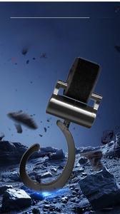 Close-up of durable black rotating hook with heavy-duty strap on stony surface