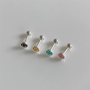 Macro detail of 925 sterling silver colorful smiley face stud earrings with 925 hallmark