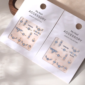 2025 New Year nail art stickers with light blue K9 crystals and gold foil nail accents
