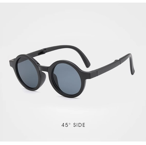 Detail view of foldable black round sunglasses for children with matte finish frame