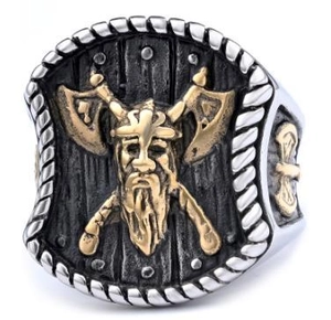 Detail of Viking warrior ring showing golden axe and shield relief on stainless steel