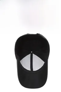 Detail of black baseball cap interior showing breathable mesh and adjustable metal buckle strap