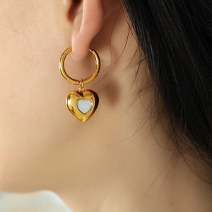 French style 18k gold plated heart hoop earrings with white shell inlay on female model