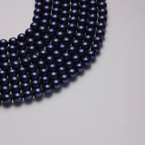 Polished 10mm deep navy South Sea shell pearls with high-gloss finish and smooth luster