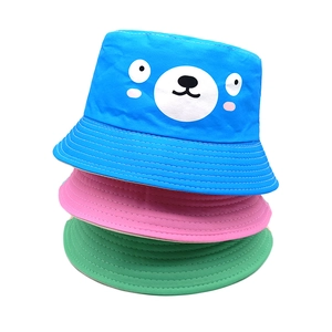 Kids reversible bucket hat with cartoon bear print in blue, pink, and green colors