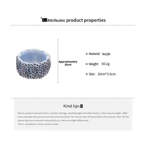 Detail view of light blue leopard acrylic bracelet with dimensions 20cm by 3.5cm