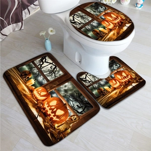 Detail view of Halloween bath mat set with spooky pumpkin and skull patterns on wood floor